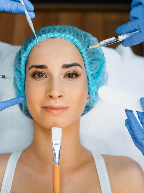 cosmetician-hands-with-working-tools-patient-face-1